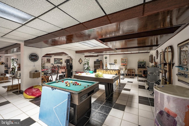 playroom featuring pool table, tile patterned floors, and arched walkways