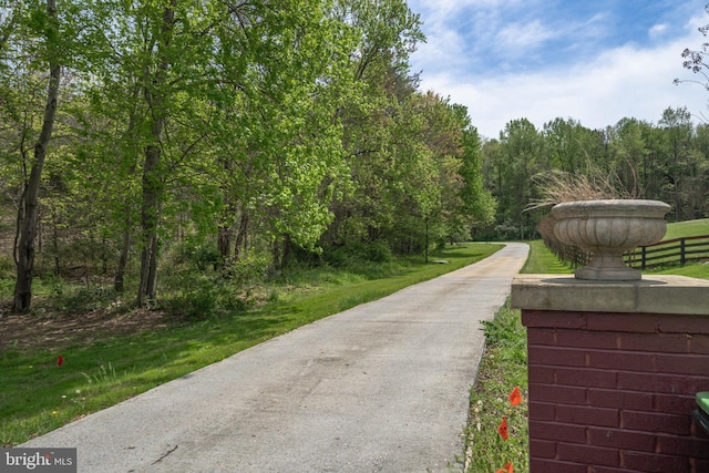 view of community with a wooded view