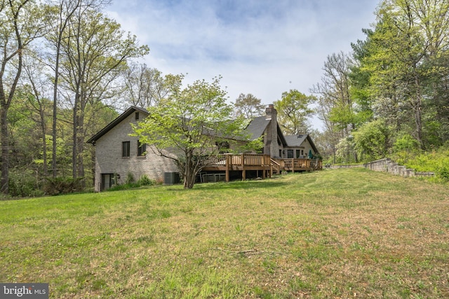 view of yard with a wooden deck