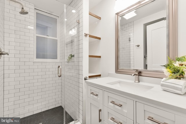 full bath featuring a stall shower and vanity