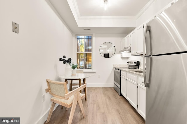 kitchen featuring ornamental molding, under cabinet range hood, white cabinetry, stainless steel appliances, and light wood finished floors