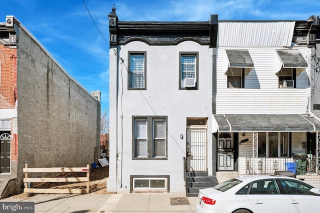 townhome / multi-family property featuring stucco siding