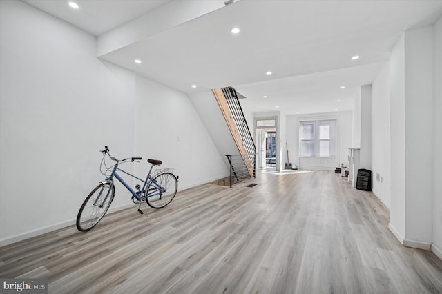 interior space featuring recessed lighting, baseboards, and light wood-style floors