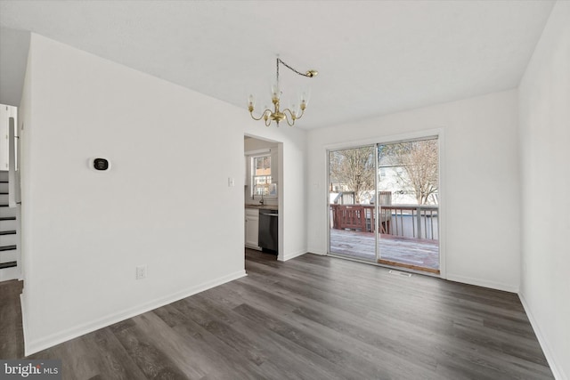 unfurnished dining area featuring visible vents, a notable chandelier, dark wood-style flooring, baseboards, and stairs