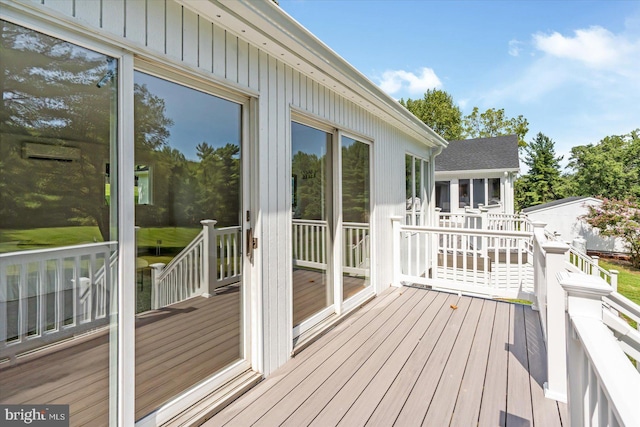 wooden terrace featuring a sunroom