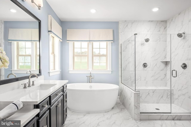 full bath with recessed lighting, a stall shower, a freestanding tub, marble finish floor, and vanity