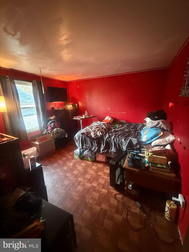 bedroom featuring wood finished floors