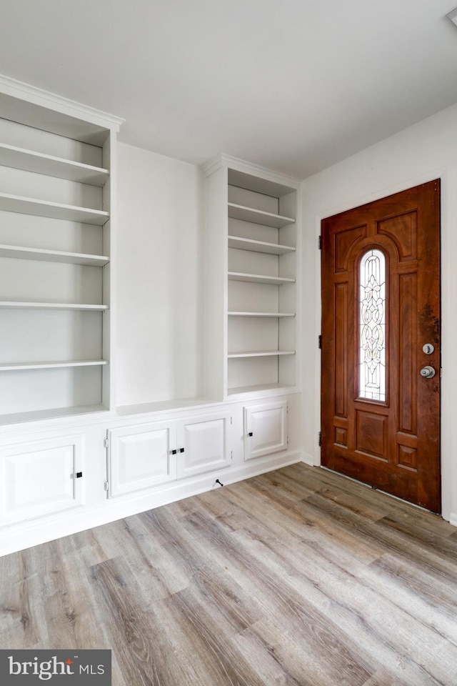 foyer entrance with wood finished floors