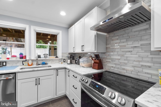 444 Grindall St, Baltimore, MD 21230 - kitchen featuring stainless steel appliances, extractor fan, a sink, decorative backsplash, and white cabinetry