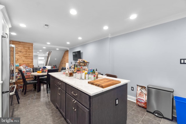 444 Grindall St, Baltimore, MD 21230 - kitchen featuring a kitchen island, recessed lighting, dark brown cabinets, light stone counters, and dark tile patterned floors
