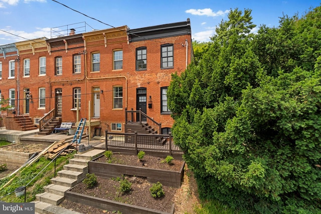 444 Grindall St, Baltimore, MD 21230 - view of front of home with a vegetable garden and brick siding