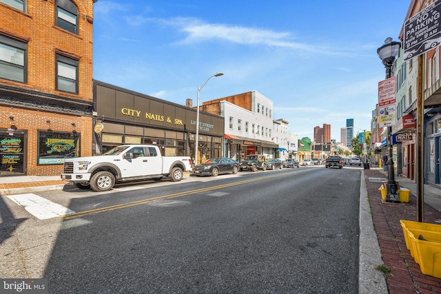 444 Grindall St, Baltimore, MD 21230 - view of asphalt street featuring street lights, sidewalks, and curbs