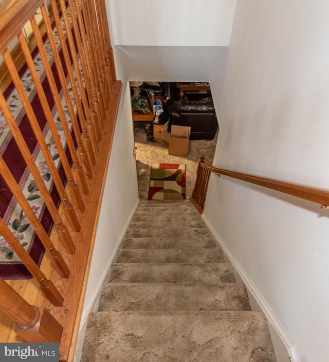 stairway featuring baseboards