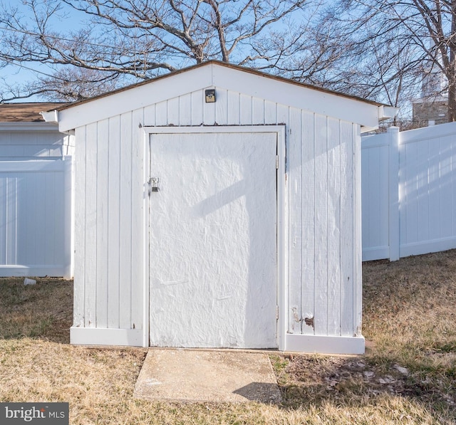 view of shed with fence