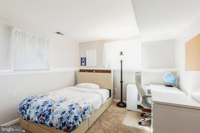 bedroom featuring light colored carpet, visible vents, and baseboards