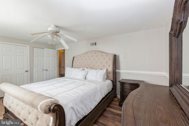 bedroom with visible vents, a closet, wood finished floors, and a ceiling fan