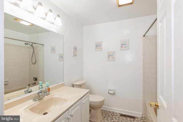 bathroom with vanity,  shower combination, toilet, and visible vents