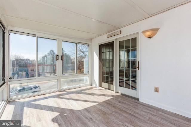 unfurnished sunroom with a wealth of natural light