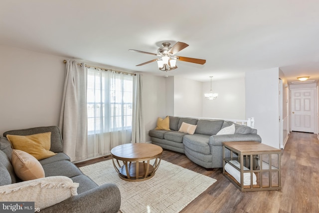 living room with a ceiling fan and wood finished floors