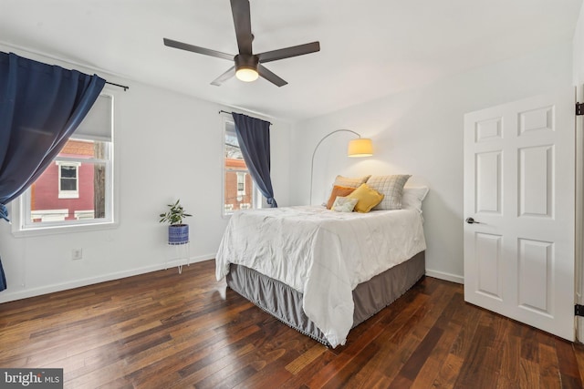 bedroom featuring hardwood / wood-style floors, baseboards, and ceiling fan