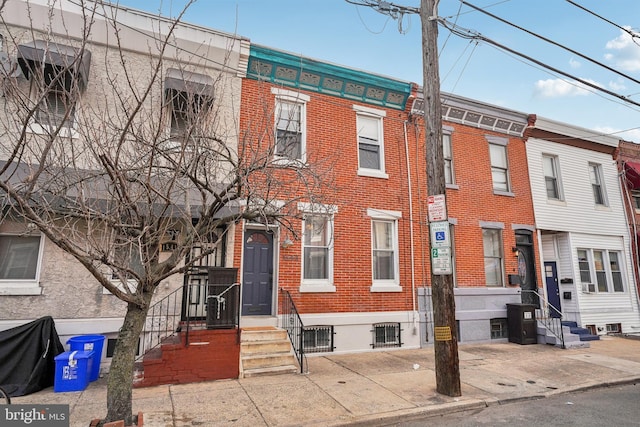 multi unit property with brick siding and entry steps