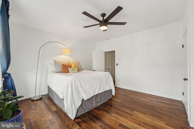 bedroom featuring ceiling fan, baseboards, and wood finished floors