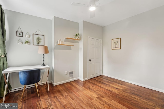 office area featuring visible vents, baseboards, a ceiling fan, and wood finished floors