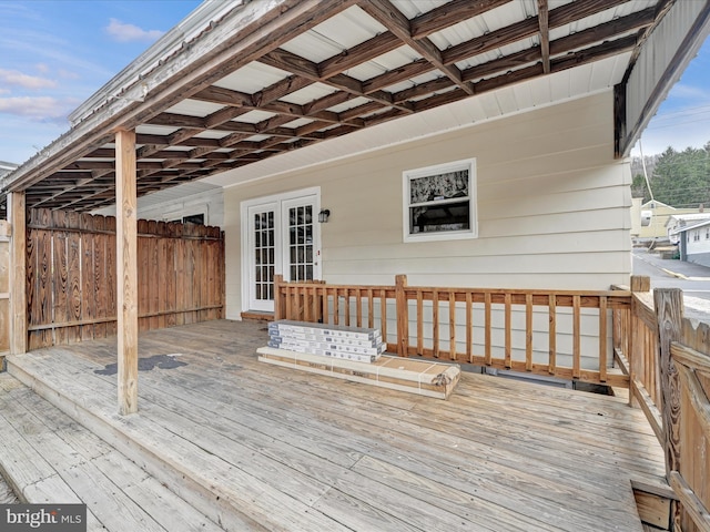 wooden deck featuring french doors and fence