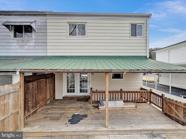 back of property featuring a deck