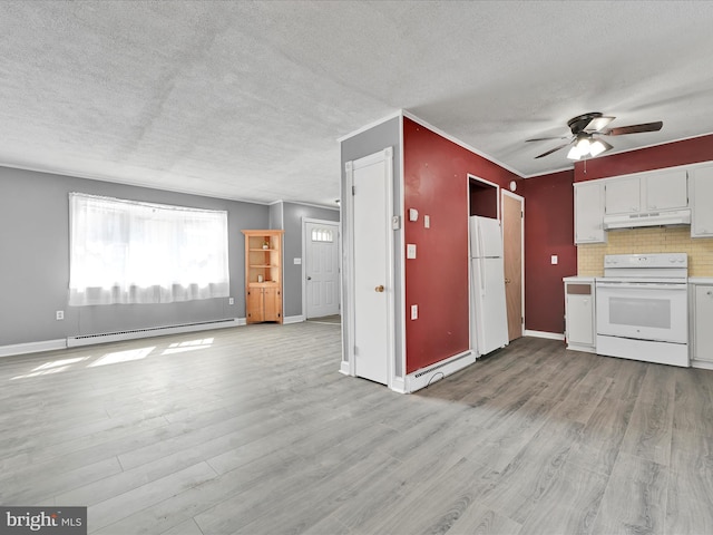 kitchen featuring under cabinet range hood, wood finished floors, white appliances, crown molding, and baseboard heating