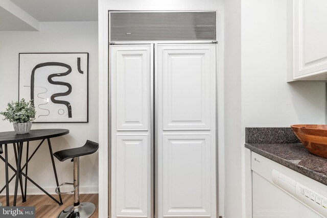 interior space with baseboards and wood finished floors