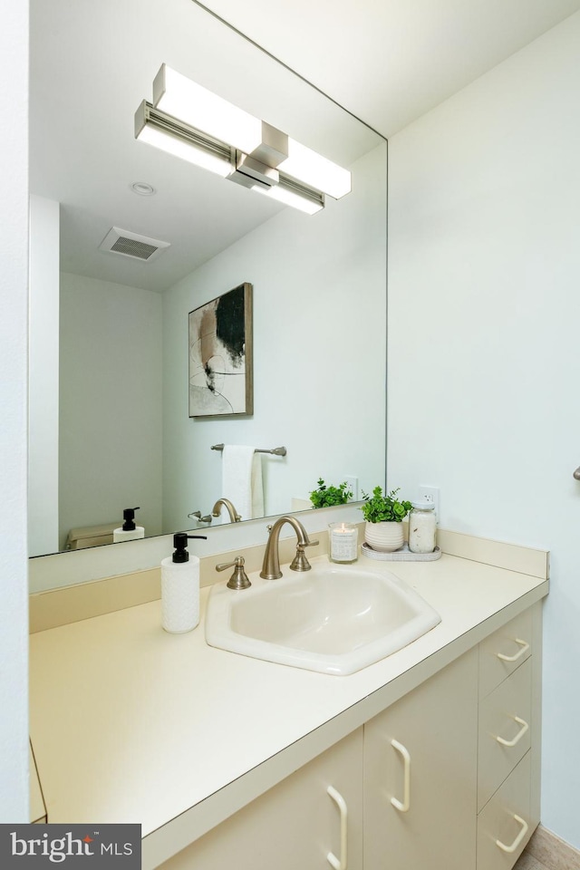 bathroom with visible vents and vanity