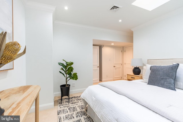 bedroom featuring visible vents, light carpet, ornamental molding, a skylight, and baseboards