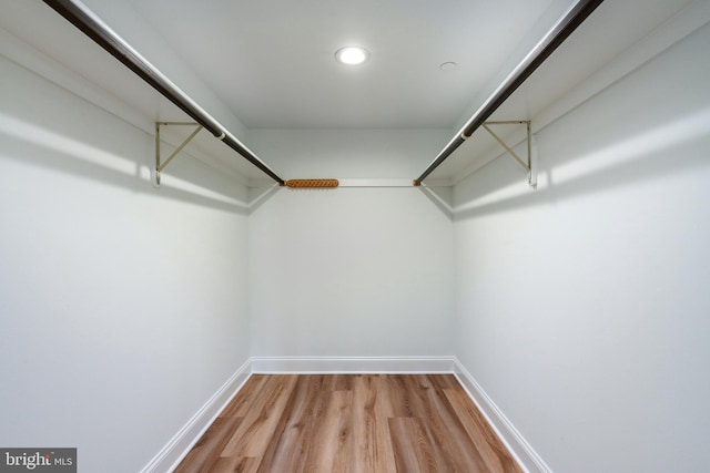 spacious closet with wood finished floors