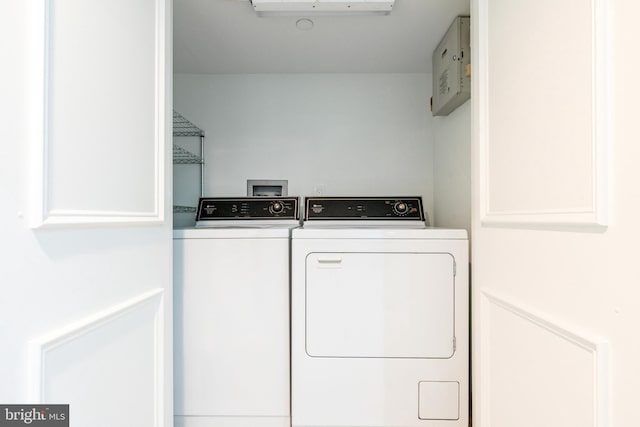 clothes washing area with laundry area and washing machine and clothes dryer