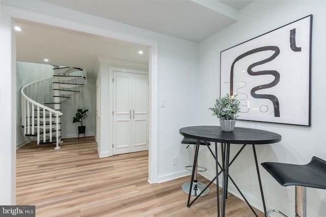 hall featuring stairway, recessed lighting, baseboards, and wood finished floors