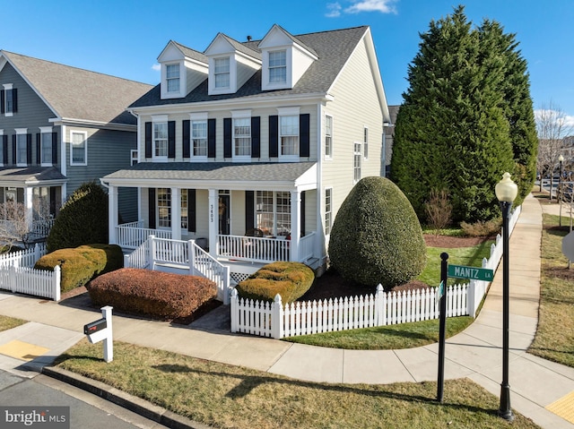 view of front of house with a fenced front yard, a porch, and roof with shingles