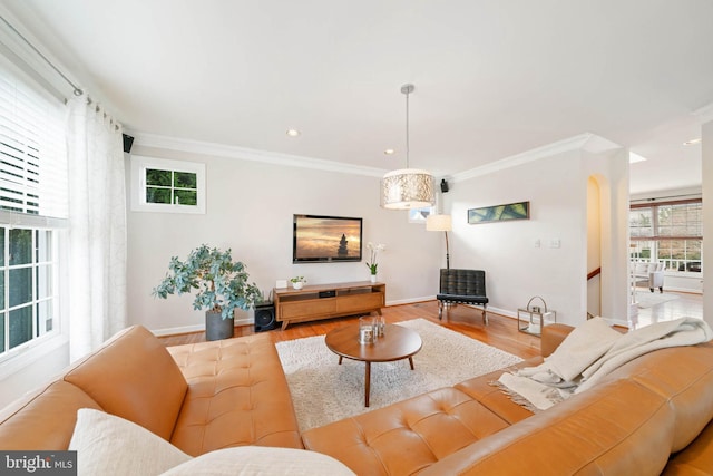 living area with recessed lighting, ornamental molding, baseboards, and wood finished floors