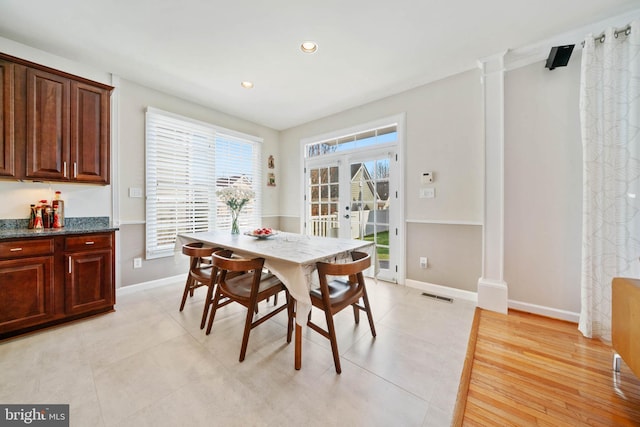 dining space featuring recessed lighting, visible vents, baseboards, and decorative columns