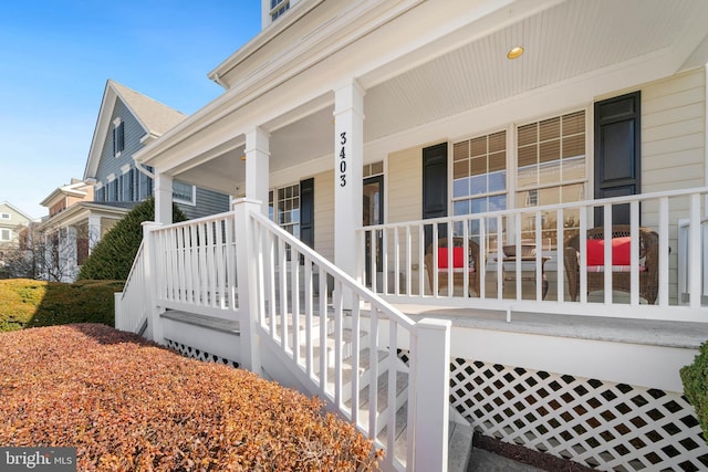 entrance to property featuring a porch