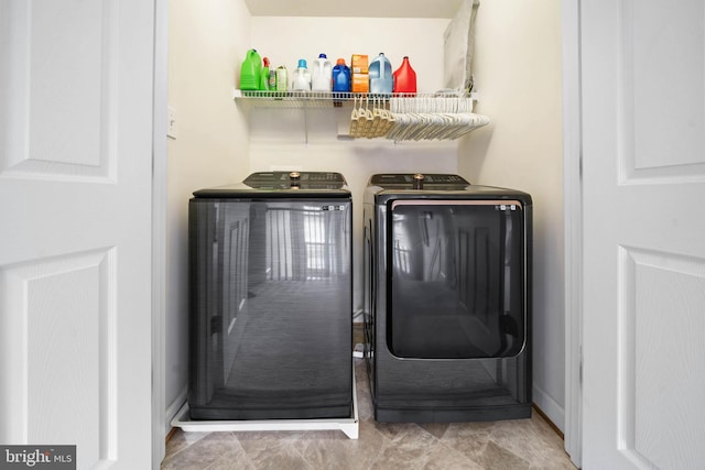 laundry area featuring laundry area and washer and clothes dryer