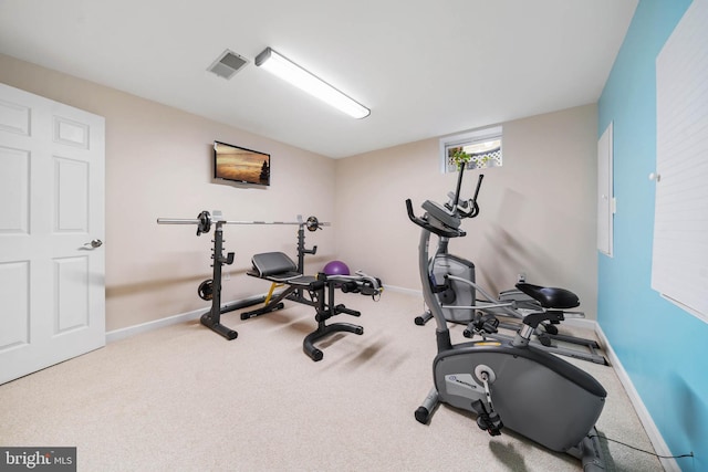 exercise area featuring carpet, baseboards, and visible vents