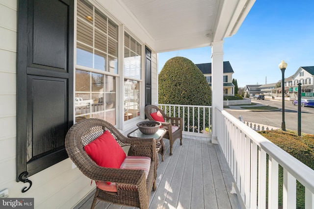 balcony featuring a porch