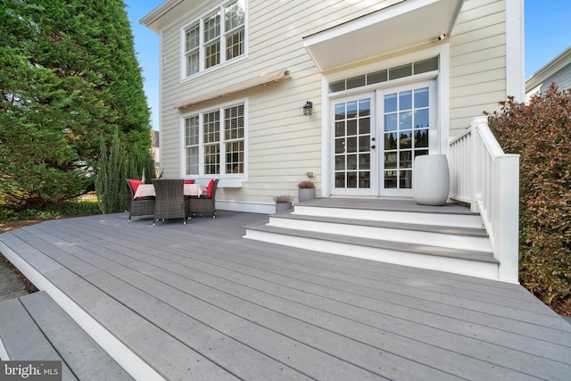 wooden terrace featuring french doors