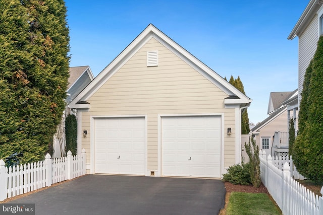 detached garage with fence