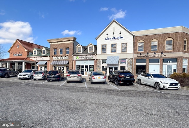 view of property featuring uncovered parking