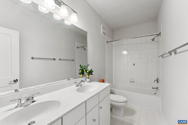 full bath featuring a sink, toilet, bathtub / shower combination, and tile patterned flooring