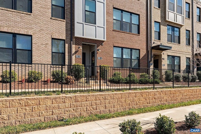 exterior space with fence and a residential view