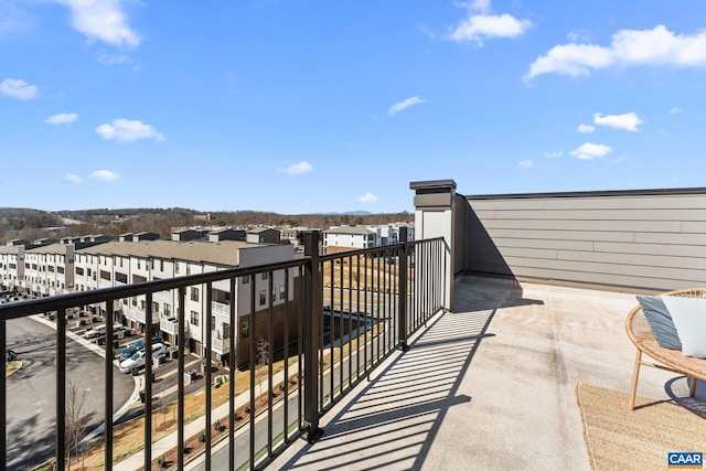 balcony featuring a residential view