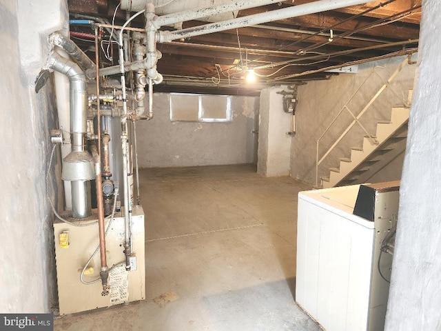 below grade area featuring washer / clothes dryer and stairs